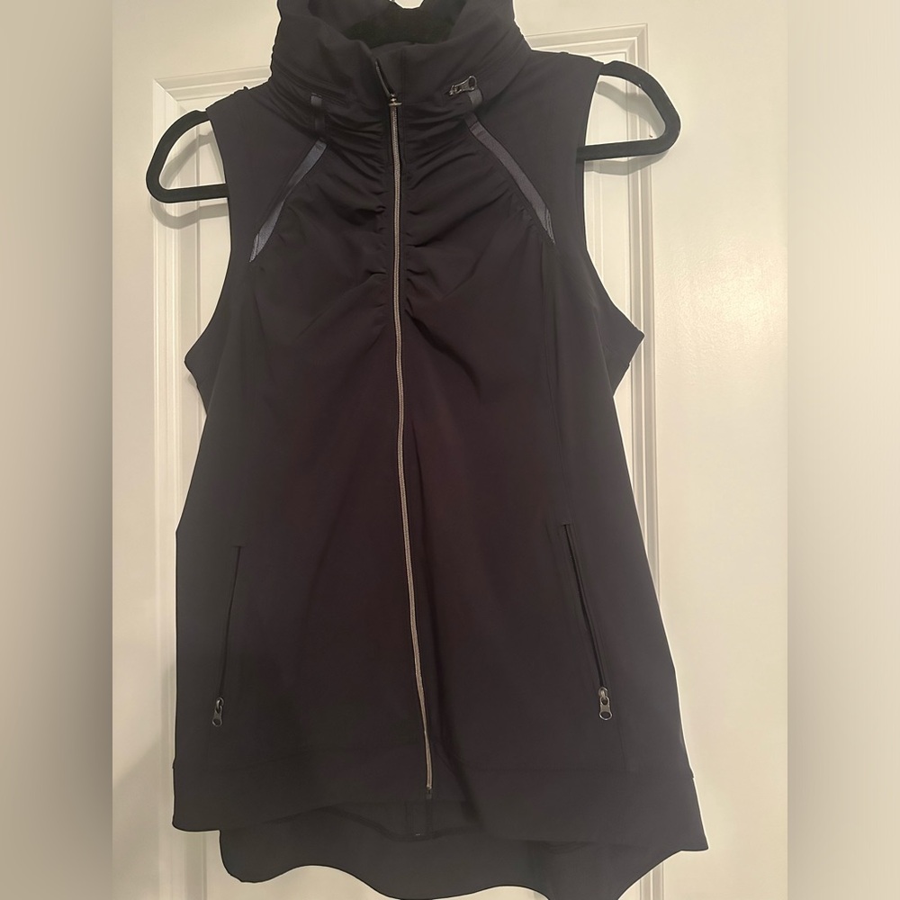 Running windbreaker vest with hood.